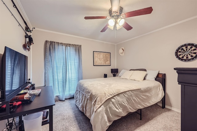 carpeted bedroom with ceiling fan, ornamental molding, and baseboards