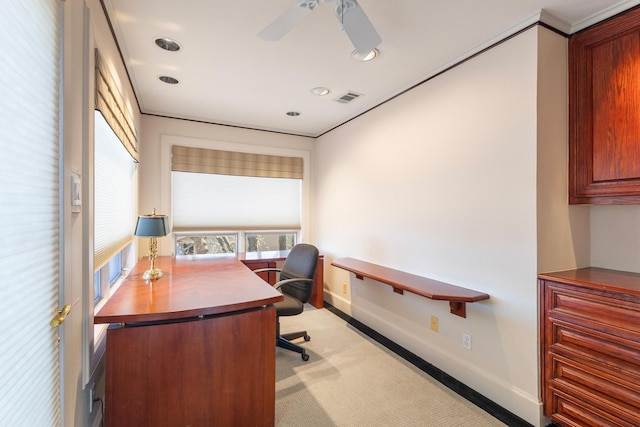 carpeted office space with a ceiling fan, visible vents, and baseboards