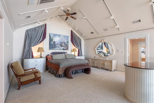 bedroom featuring visible vents, light carpet, and track lighting