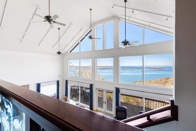 room details with a water view, ceiling fan, and track lighting