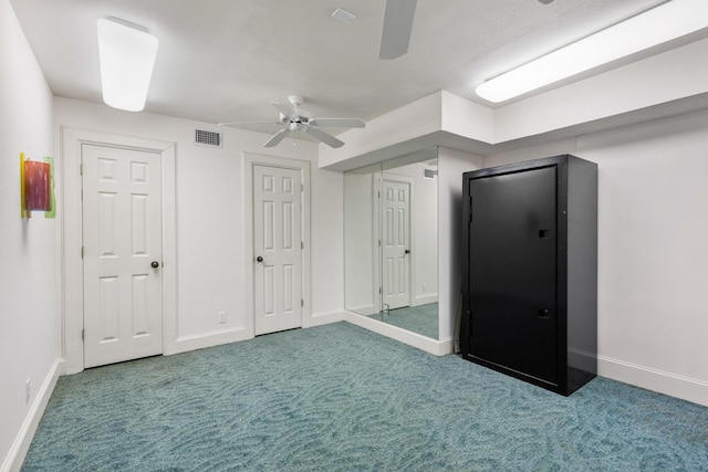 unfurnished bedroom featuring carpet floors, two closets, visible vents, a ceiling fan, and baseboards