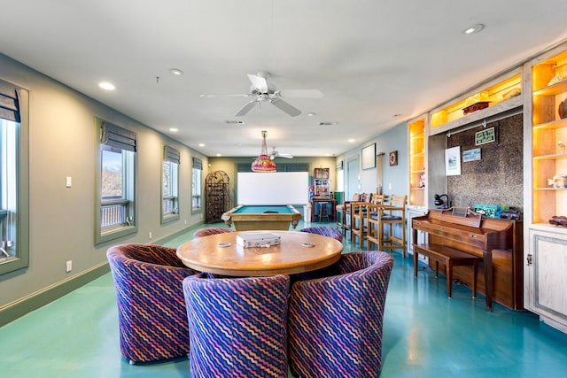 living room with concrete flooring, recessed lighting, billiards, and baseboards