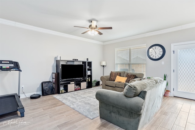 living room featuring light wood-style floors, crown molding, baseboards, and a ceiling fan