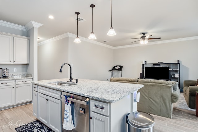 kitchen with visible vents, light wood-style flooring, stainless steel dishwasher, white cabinets, and a sink