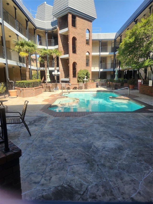 pool with a patio area