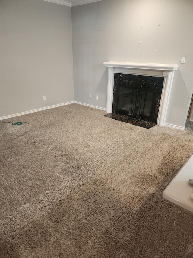 room details featuring carpet floors, a high end fireplace, and baseboards