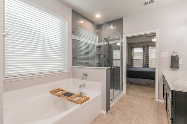 ensuite bathroom with visible vents, connected bathroom, a garden tub, vanity, and a shower stall