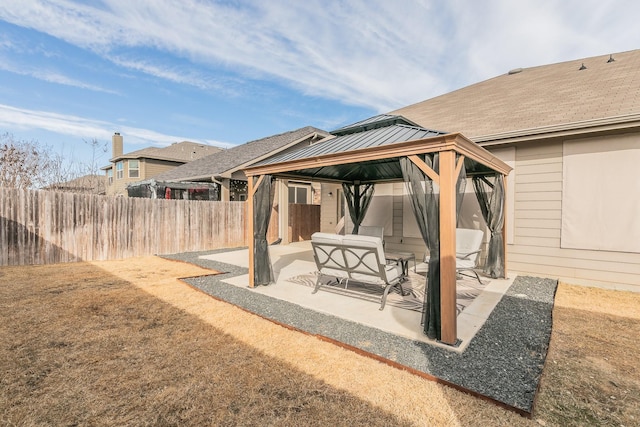 view of patio / terrace with a gazebo and fence