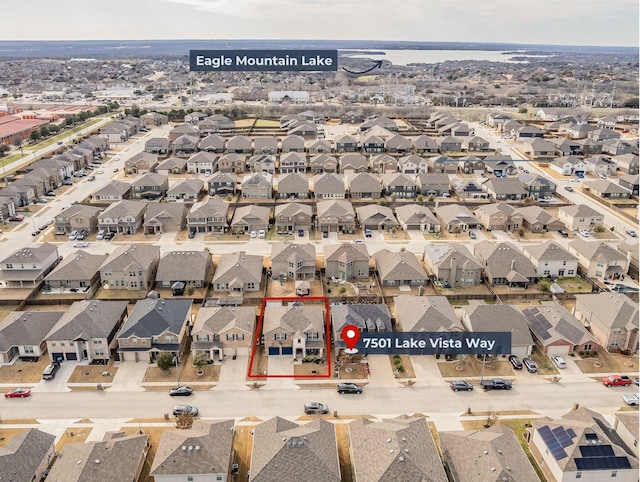 birds eye view of property with a residential view