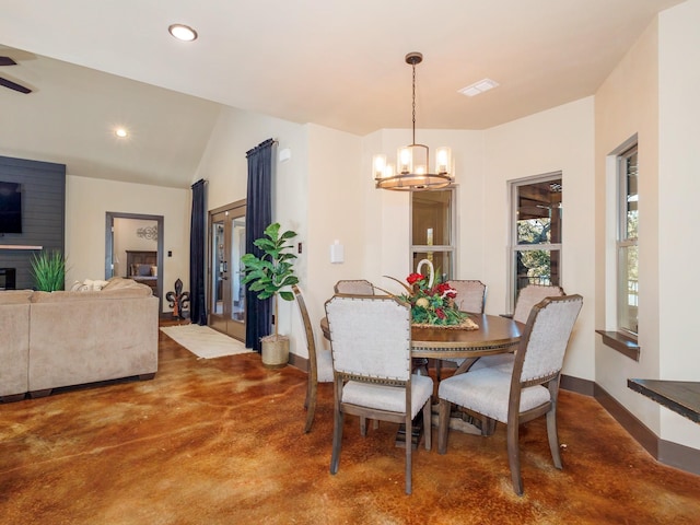 dining room with finished concrete flooring, lofted ceiling, recessed lighting, an inviting chandelier, and baseboards