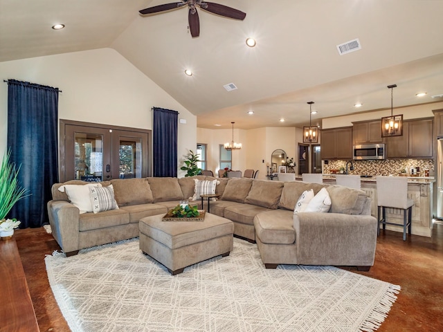 living area with high vaulted ceiling, french doors, visible vents, and recessed lighting