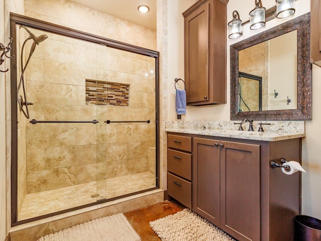 full bath featuring a stall shower and vanity