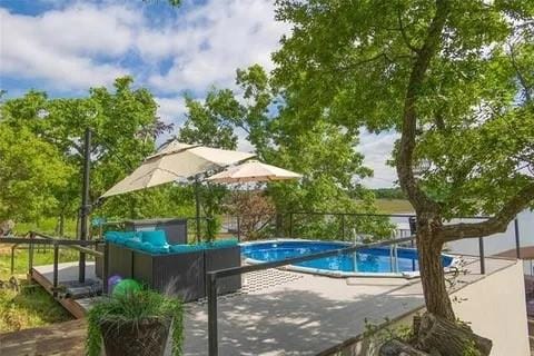 outdoor pool with a patio