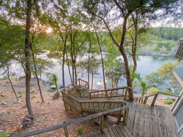 wooden deck with a water view