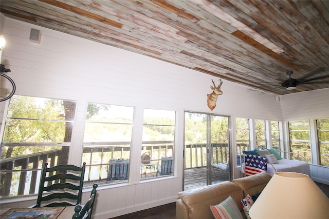 sunroom with wooden ceiling and ceiling fan