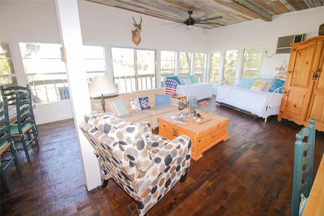 living room with dark wood finished floors, beamed ceiling, a wall mounted AC, and ceiling fan