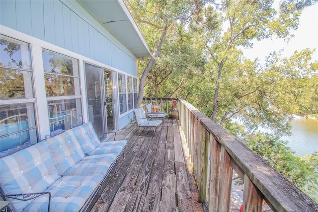 wooden terrace with a water view