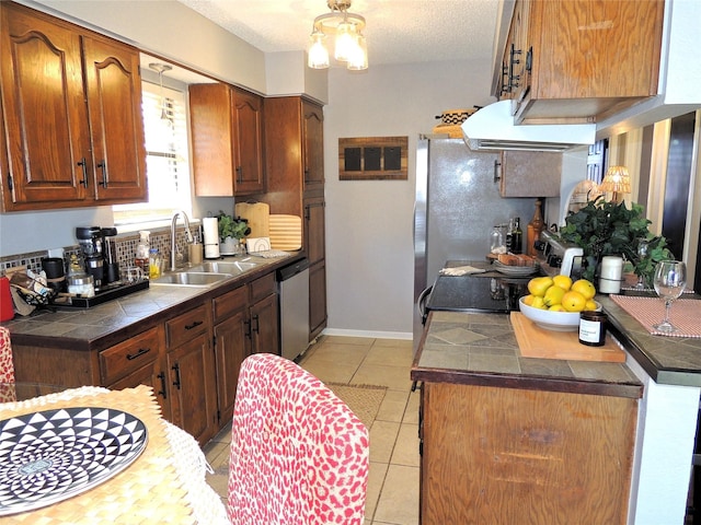 kitchen featuring light tile patterned floors, tile countertops, range hood, stainless steel dishwasher, and a sink