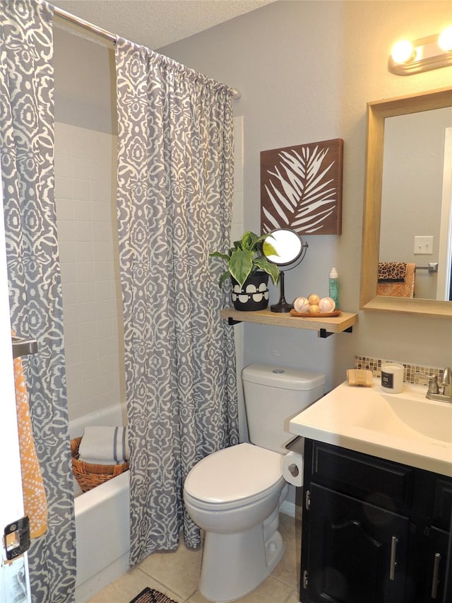 full bathroom with a textured ceiling, toilet, vanity, tile patterned floors, and shower / bath combo with shower curtain