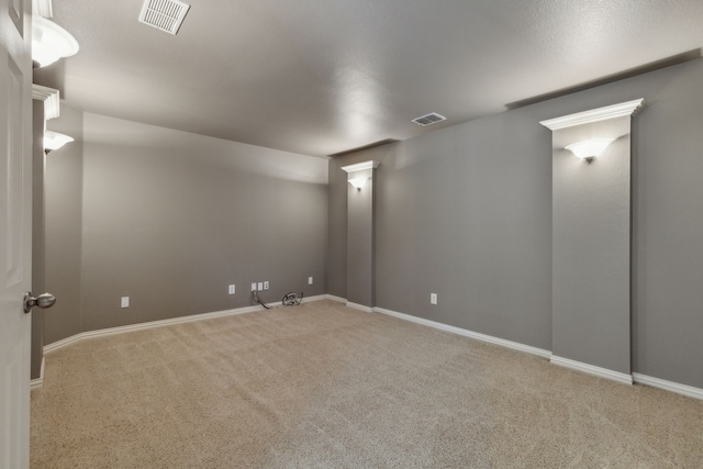 interior space with visible vents, baseboards, and carpet flooring