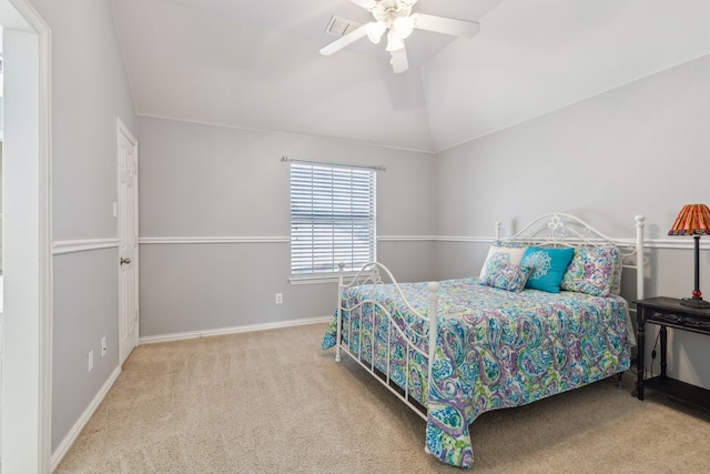 bedroom featuring visible vents, baseboards, ceiling fan, lofted ceiling, and carpet flooring