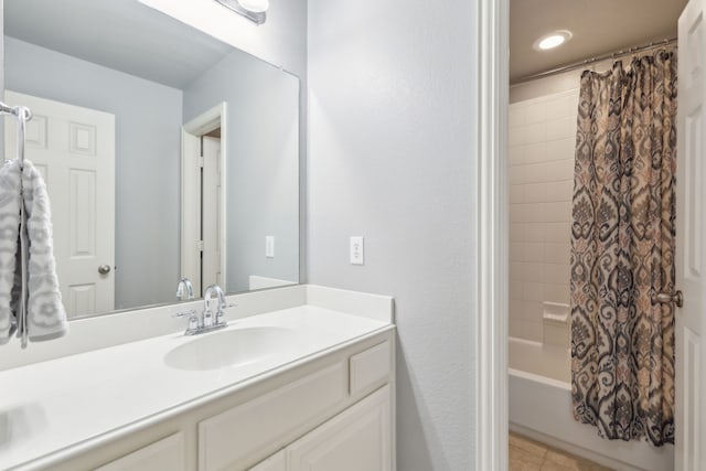 full bath featuring tile patterned floors, vanity, and shower / bath combo