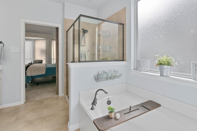 full bathroom featuring connected bathroom, a shower stall, a bath, and tile patterned floors