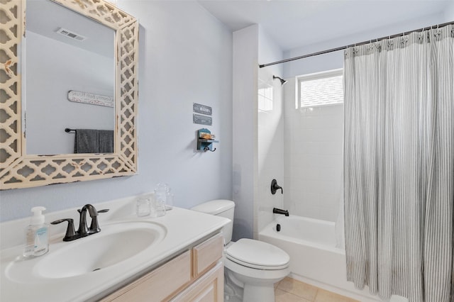 full bathroom with toilet, visible vents, vanity, tile patterned floors, and shower / bath combo with shower curtain