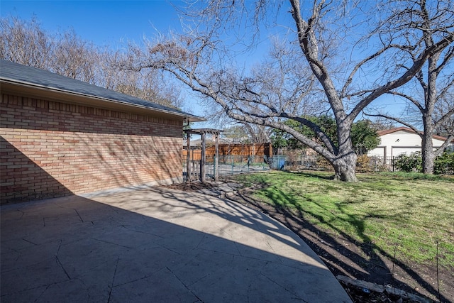 view of patio featuring fence