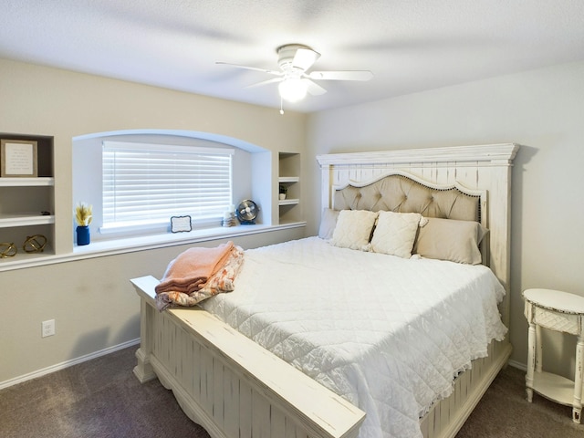 carpeted bedroom with ceiling fan and baseboards