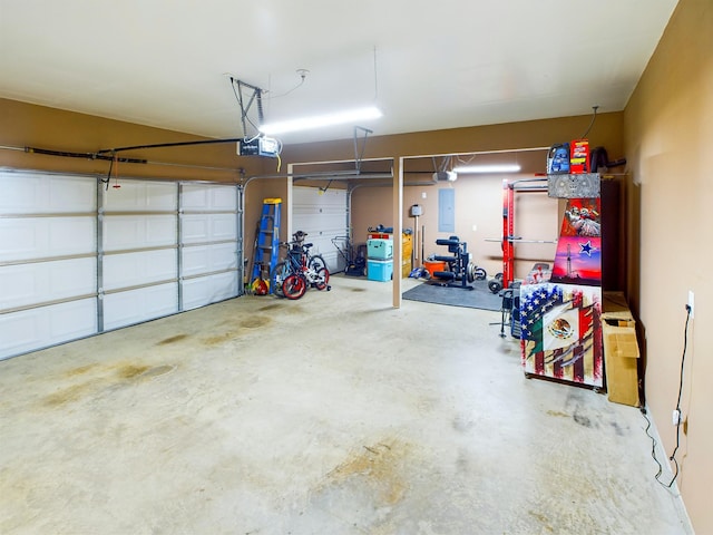 garage with electric panel and a garage door opener