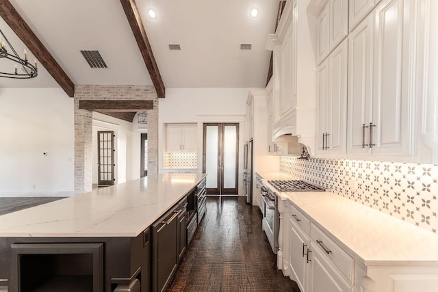 704 Glade Park Ct, Azle, TX 76020 - kitchen featuring french doors, appliances with stainless steel finishes, white cabinetry, a spacious island, and beamed ceiling