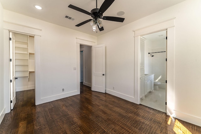 704 Glade Park Ct, Azle, TX 76020 - unfurnished bedroom featuring recessed lighting, a closet, ensuite bath, a spacious closet, and wood finished floors