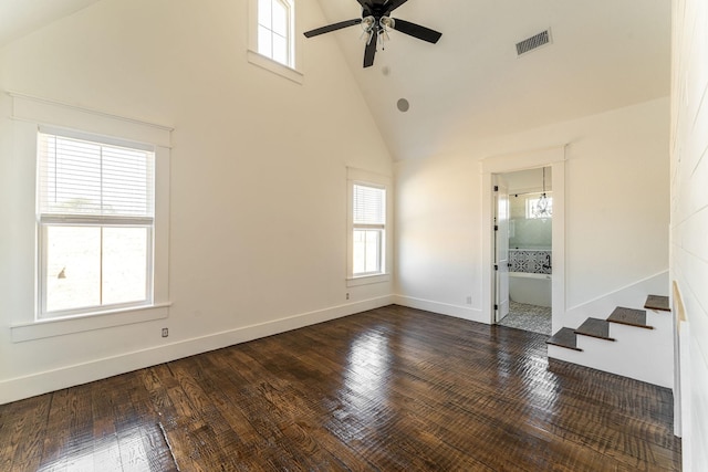704 Glade Park Ct, Azle, TX 76020 - empty room featuring healthy amount of natural light, high vaulted ceiling, ceiling fan, stairs, and dark wood finished floors