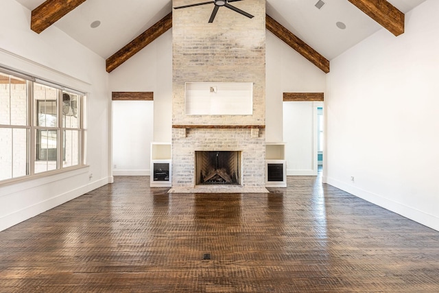 704 Glade Park Ct, Azle, TX 76020 - unfurnished living room featuring beamed ceiling, a ceiling fan, high vaulted ceiling, a brick fireplace, and wood finished floors