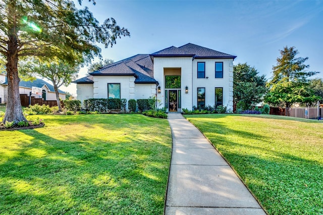 view of front of house featuring a front yard and fence