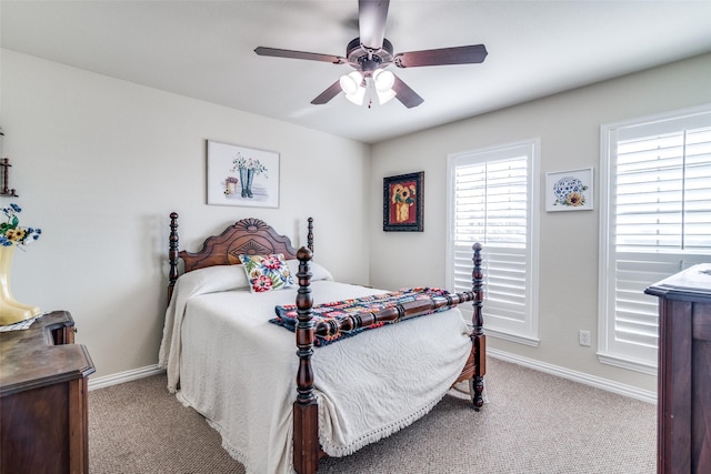 bedroom with carpet floors, ceiling fan, and baseboards