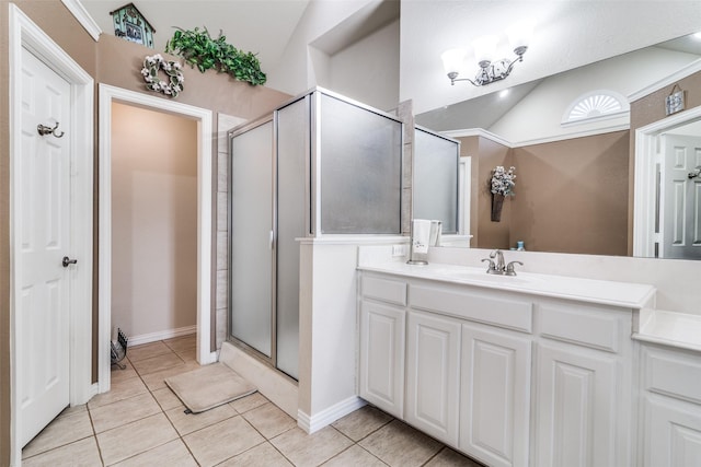 full bath with lofted ceiling, a stall shower, vanity, and tile patterned floors