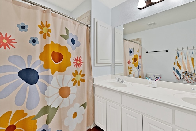 214 Willow Creek Dr, Weatherford, TX 76085 - full bathroom with a shower with curtain, visible vents, a sink, and double vanity