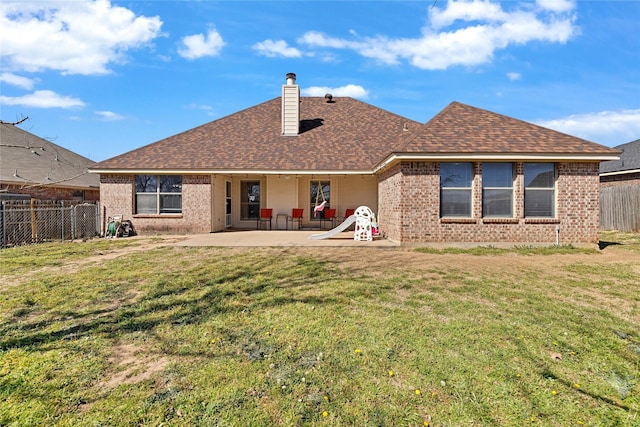214 Willow Creek Dr, Weatherford, TX 76085 - back of property with a patio area, a fenced backyard, and a lawn