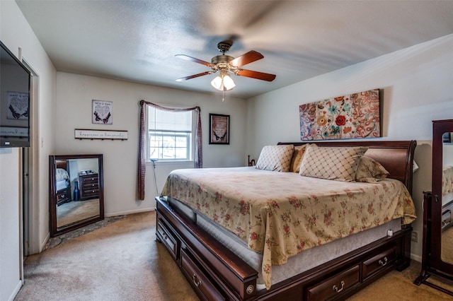 bedroom featuring a ceiling fan, baseboards, and light carpet