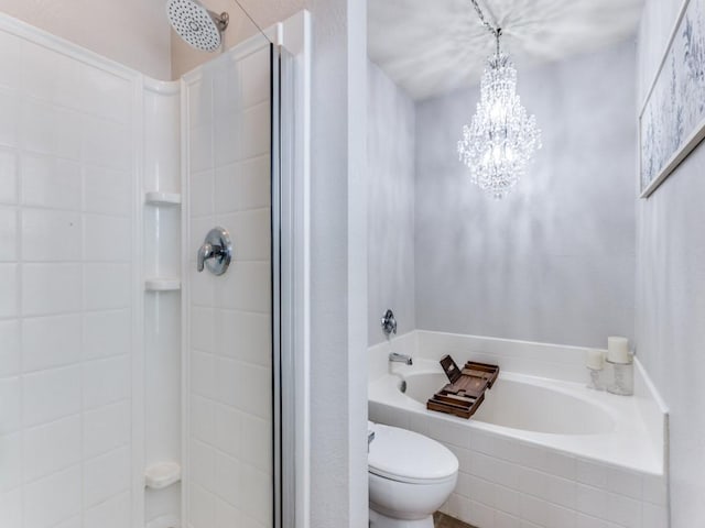 full bathroom featuring toilet, an inviting chandelier, a garden tub, and a stall shower