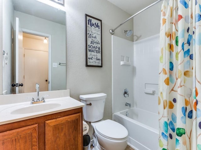 bathroom featuring vanity, shower / tub combo with curtain, a textured wall, and toilet