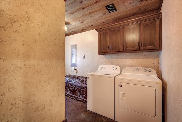 clothes washing area with cabinet space, electric panel, visible vents, wooden ceiling, and washing machine and dryer