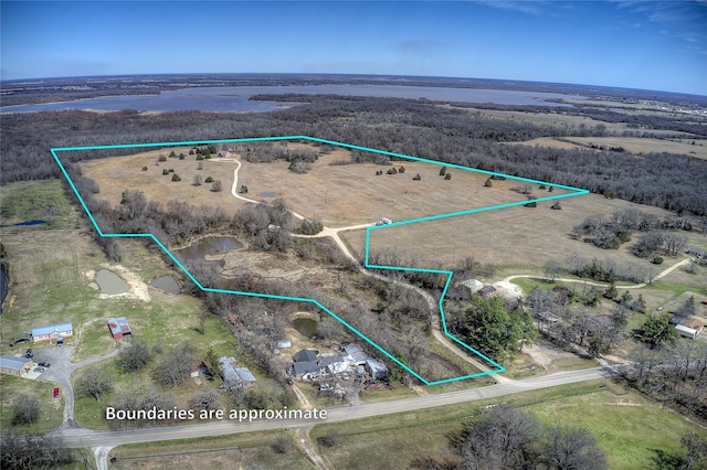 birds eye view of property with a rural view