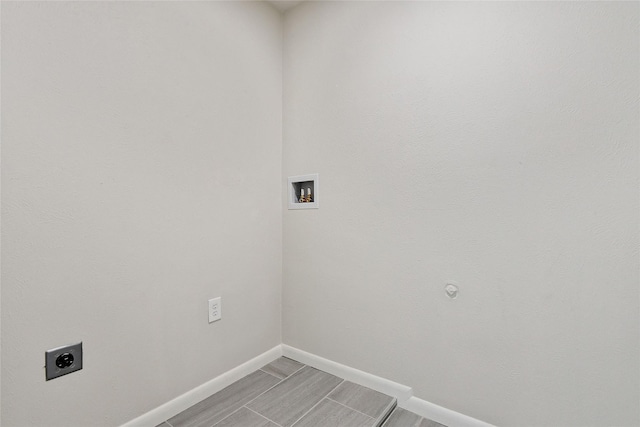 washroom with laundry area, washer hookup, electric dryer hookup, and baseboards