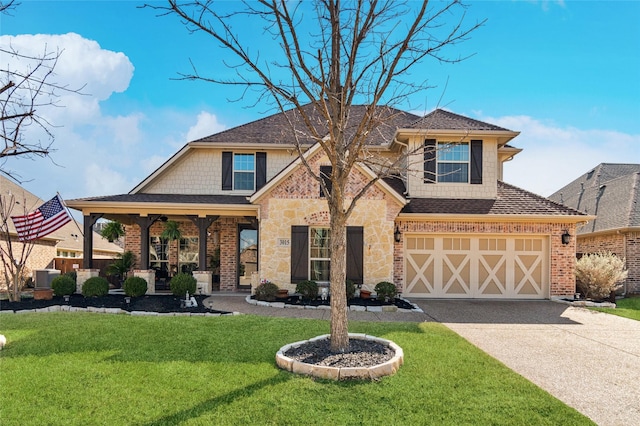 view of front of home featuring a garage, brick siding, driveway, stone siding, and a front lawn