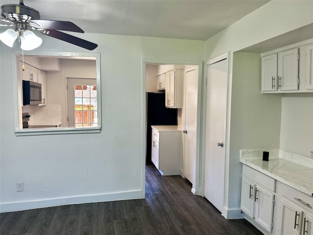 3616 Parkridge Dr Unit 108, Dallas, TX 75234 - kitchen featuring white cabinets, dark wood-style floors, appliances with stainless steel finishes, and ceiling fan