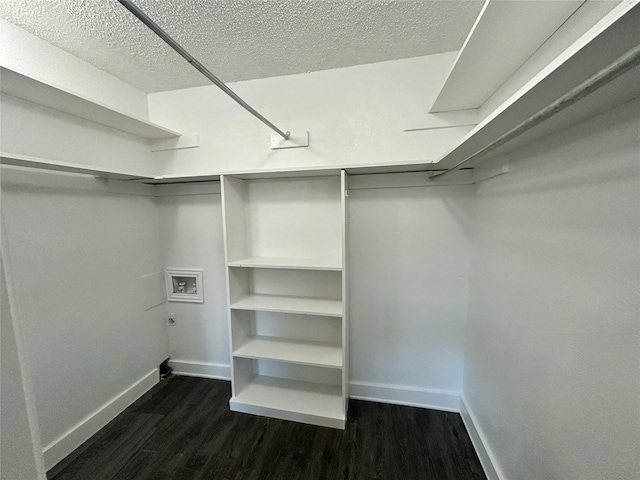 3616 Parkridge Dr Unit 108, Dallas, TX 75234 - walk in closet featuring dark wood-style flooring