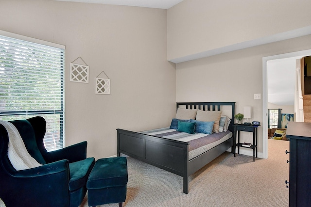 carpeted bedroom featuring baseboards